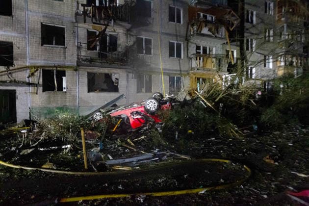 An overturned car, flipped by the shock wave, lies beside a five-storey apartment block partially destroyed in an overnight Russian strike in the Solomianskyi district, Kyiv, Ukraine, August 1, 2026. The attack caused partial collapse and fire in the building. Rescue workers evacuated 35 residents from the upper floors. Two people were killed and eight injured. (Photo by Kyrylo Chubotin Ukrinform) Russian attack damages apartment block in Kyiv’s Solomianskyi district  Copyright: xKyryloxChubotinx