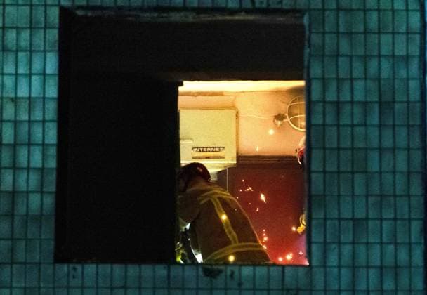 State Emergency Service rescuers force open the jammed entrance door to a flat in a five-storey apartment block in the Solomianskyi district that was partially destroyed by an overnight Russian strike, Kyiv, Ukraine, August 1, 2026. The attack caused partial collapse and fire in the building. Rescue workers evacuated 35 residents from the upper floors. Two people were killed and eight injured. (Photo by Kyrylo Chubotin Ukrinform) Russian attack damages apartment block in Kyiv’s Solomianskyi district  Copyright: xKyryloxChubotinx