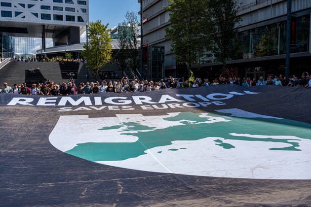 August 1, 2026, Utrecht, Utrecht, The Netherlands: The organization Save Europe Act is kicking off the so-called European Shield Tour at Jaarbeursplein in Utrecht. During the demonstration, several participants are wearing clothing bearing the word Ã¢â‚¬ËœRemigration,Ã¢â‚¬â ¢ and a large banner with the same text is rolled out. Speakers are calling for remigration. Among those present, several Dutch flags and a Flemish flag are visible. Utrecht The Netherlands  - ZUMAg281 20260801_zaf_g281_010 Copyright: xStormxGroenendijkx