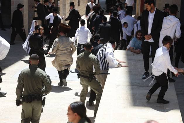 Ultra-Orthodox Protest in Jerusalem WEST JERUSALEM August 1, 2026: Ultra-Orthodox Jewish protesters clash with police officers and secular Jewish demonstrators during a protest against the opening of a cafÃ on Shabbat in West Jerusalem. The demonstration took place after protesters opposed the operation of the cafÃ during the Jewish day of rest. JERUSALEM Israel Copyright: x xSaeedxQaqx xJNAxPressx