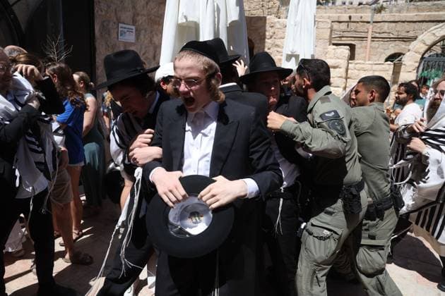 Ultra-Orthodox Protest in Jerusalem WEST JERUSALEM August 1, 2026: Ultra-Orthodox Jewish protesters clash with police officers and secular Jewish demonstrators during a protest against the opening of a cafÃ on Shabbat in West Jerusalem. The demonstration took place after protesters opposed the operation of the cafÃ during the Jewish day of rest. JERUSALEM Israel Copyright: x xSaeedxQaqx xJNAxPressx