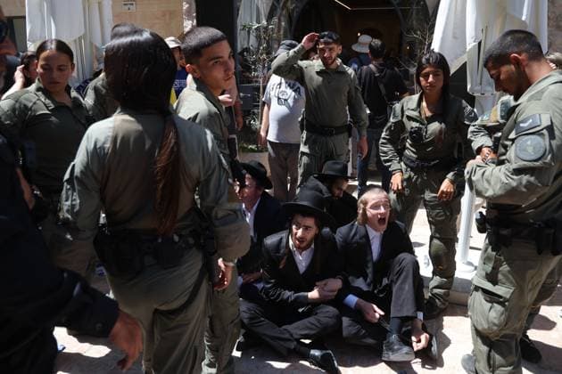 Ultra-Orthodox Protest in Jerusalem WEST JERUSALEM August 1, 2026: Ultra-Orthodox Jewish protesters clash with police officers and secular Jewish demonstrators during a protest against the opening of a cafÃ on Shabbat in West Jerusalem. The demonstration took place after protesters opposed the operation of the cafÃ during the Jewish day of rest. JERUSALEM Israel Copyright: x xSaeedxQaqx xJNAxPressx