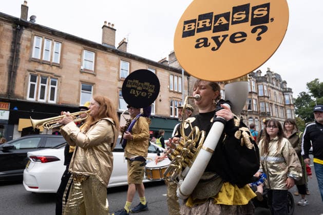 August 1, 2026, Glasgow, Scotland, UK: Hundreds of people took part in this years Govanhill International Festival & Carnival parade, a community-led anti-racist arts and cultural event organised by the Govanhill Baths Community Trust. The annual festival, themed Solidarity this year, was founded in response to racist attacks in the area. Glasgow UK - ZUMAs357 20260801_zip_s357_001 Copyright: xCameronxScottx