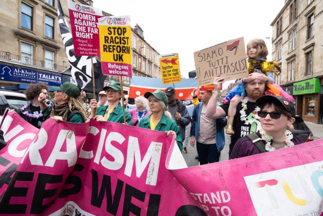 August 1, 2026, Glasgow, Scotland, UK: Hundreds of people took part in this years Govanhill International Festival & Carnival parade, a community-led anti-racist arts and cultural event organised by the Govanhill Baths Community Trust. The annual festival, themed Solidarity this year, was founded in response to racist attacks in the area. Glasgow UK  - ZUMAs357 20260801_zip_s357_003 Copyright: xCameronxScottx