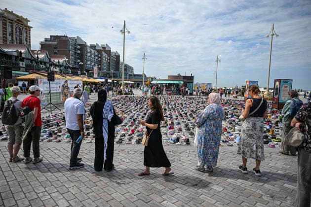 Thousands of shoes displayed on The Hague Beach in memory of children killed in Gaza THE HAGUE, NETHERLANDS - AUGUST 1: Thousands of shoes are placed on Scheveningen Beach during a public memorial to symbolize children killed in Gaza, in The Hagues, Netherlands on August 01, 2026. The installation, held near the Kurhaus, formed part of a peaceful demonstration calling attention to the humanitarian impact of the war, with participants gathering throughout the day to pay tribute and express solidarity. Mouneb Taim Anadolu The Hague Netherlands. Editorial use only. Please get in touch for any other usage.  Copyright: x2026xAnadoluxMounebxTaimx