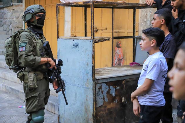 Israeli settlers raid Hebron under the protection of Israeli forces HEBRON, WEST BANK, PALESTINE - AUGUST 1: Israeli settlers raid the Old City area of Hebron under the protection of Israeli forces in Hebron, West Bank, Palestine on August 1, 2026. During the raid, Israeli forces blocked entrances and exits with metal barriers, restricting the movement of Palestinians in the area. Amer Shallodi Anadolu Hebron West Bank. Editorial use only. Please get in touch for any other usage.  Copyright: x2026xAnadoluxAmerxShallodix