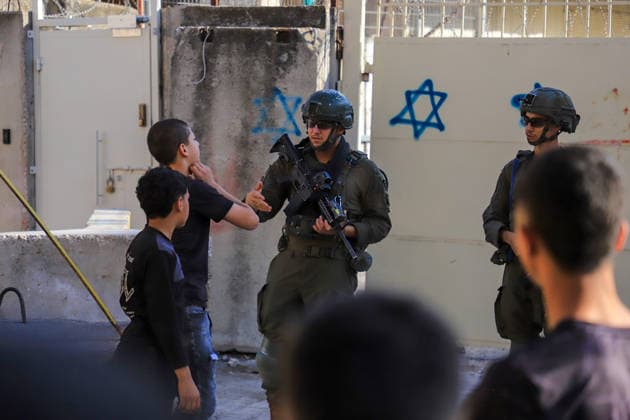 Israeli settlers raid Hebron under the protection of Israeli forces HEBRON, WEST BANK, PALESTINE - AUGUST 1: Israeli settlers raid the Old City area of Hebron under the protection of Israeli forces in Hebron, West Bank, Palestine on August 1, 2026. During the raid, Israeli forces blocked entrances and exits with metal barriers, restricting the movement of Palestinians in the area. Amer Shallodi Anadolu Hebron West Bank. Editorial use only. Please get in touch for any other usage.  Copyright: x2026xAnadoluxAmerxShallodix