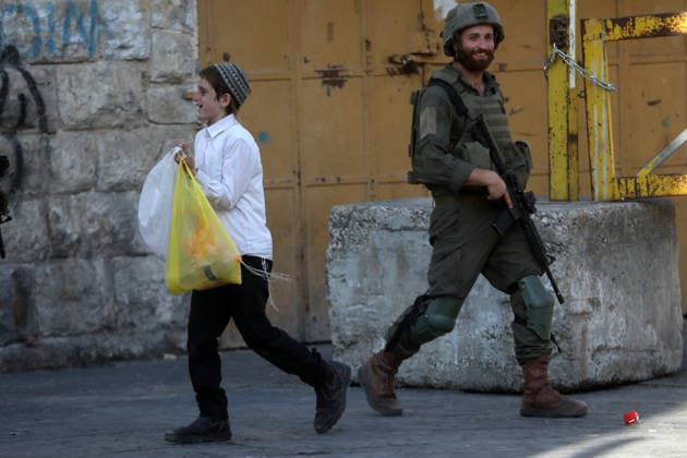 Israeli-protected settlers tour Hebron s Old City Israeli settlers walk through the Old City of Hebron, in the occupied West Bank, under the protection of Israeli troops after the forces closed roads and alleys in the area, restricting the movement of Palestinian residents during the raid, on August 1, 2026. Photo by Mamoun Wazwaz apaimages Hebron West Bank Palestinian Territory 010826_Hebron_MW_00(24) Copyright: xapaimagesxMamounxWazwazx xapaimagesx