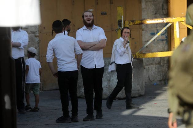 Israeli-protected settlers tour Hebron s Old City Israeli settlers walk through the Old City of Hebron, in the occupied West Bank, under the protection of Israeli troops after the forces closed roads and alleys in the area, restricting the movement of Palestinian residents during the raid, on August 1, 2026. Photo by Mamoun Wazwaz apaimages Hebron West Bank Palestinian Territory 010826_Hebron_MW_00(27) Copyright: xapaimagesxMamounxWazwazx xapaimagesx
