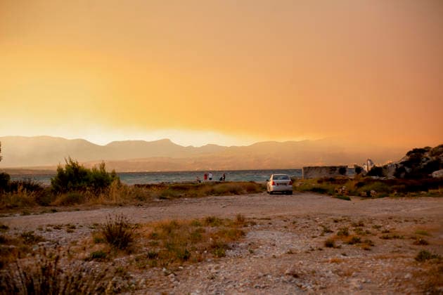 Wildfire Smoke and Strong Winds Hit Corinthia Coast Wildfire smoke hangs above the mountains overlooking the coast in Almiri, Corinthia, Greece on August 1, 2026. Smoke from a wildfire burning in the neighboring regional unit of Viotia spreads across the Saronic Gulf as firefighters continue efforts to contain the blaze. Almiri Corinthia Greece Copyright: xElvisxTakahashixMantellox
