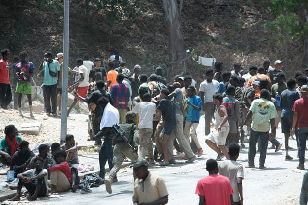 August 1, 2026, Ceuta, Ceuta, Spain: Migrants fight for food near the CETI temporary stay centre. Ceuta Spain - ZUMAd308 20260801_zsp_d308_072 Copyright: xJuanxCarlosxLucasx