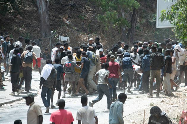 August 1, 2026, Ceuta, Ceuta, Spain: Migrants fight for food near the CETI temporary stay centre. Ceuta Spain - ZUMAd308 20260801_zsp_d308_073 Copyright: xJuanxCarlosxLucasx