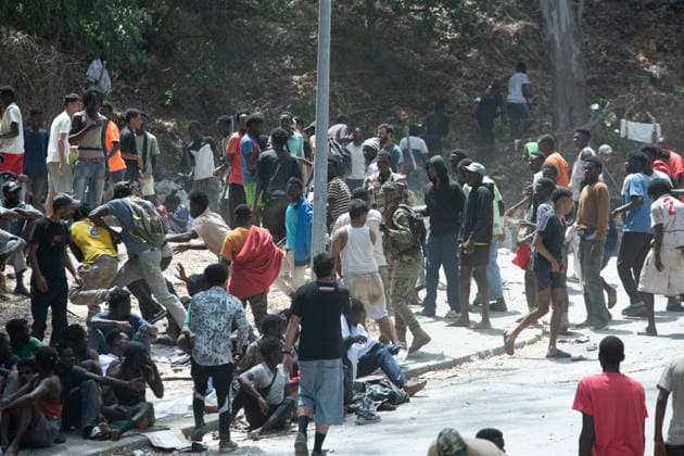 August 1, 2026, Ceuta, Ceuta, Spain: Migrants fight for food near the CETI temporary stay centre. Ceuta Spain - ZUMAd308 20260801_zsp_d308_074 Copyright: xJuanxCarlosxLucasx