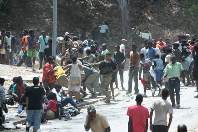 August 1, 2026, Ceuta, Ceuta, Spain: Migrants fight for food near the CETI temporary stay centre. Ceuta Spain - ZUMAd308 20260801_zsp_d308_075 Copyright: xJuanxCarlosxLucasx