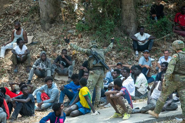 August 1, 2026, Ceuta, Ceuta, Spain: Migrants fight for food near the CETI temporary stay centre. Ceuta Spain - ZUMAd308 20260801_zsp_d308_077 Copyright: xJuanxCarlosxLucasx