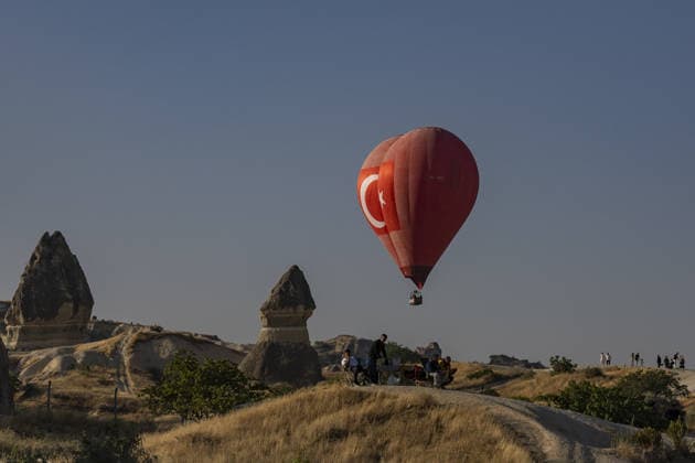 Cappadocia Balloon Festival concludes with colorful scenes NEVSEHIR, TURKIYE - AUGUST 2: A view of a Turkish flag shaped balloon during the 7th Cappadocia Balloon Festival concluded with the participation of 30 special-shaped hot air balloons brought from Turkiye and abroad in Nevsehir, Turkiye, on August 2, 2026. As part of the festival, sunrise demonstration flights over Goreme featured heart, owl, parrot, rocket, and globe-shaped balloons, creating colorful scenes above the region s iconic fairy chimneys and attracting the attention of both local and international visitors. Osmancan Gurdogan Anadolu Nevsehir Turkey. Editorial use only. Please get in touch for any other usage.  Copyright: x2026xAnadoluxOsmancanxGurdoganx