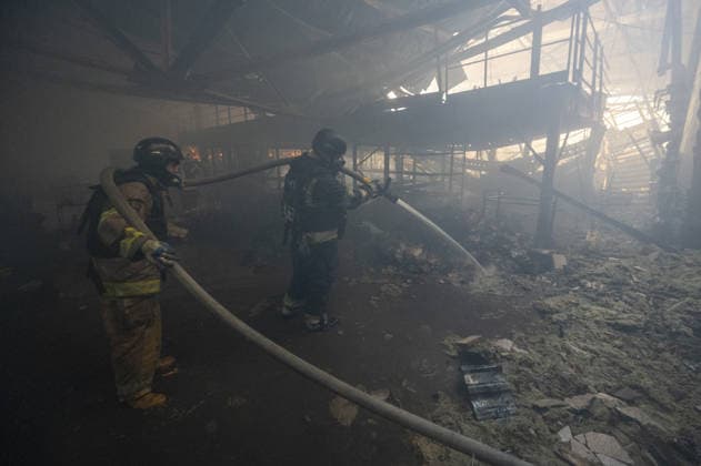 Russian drone strike hits book warehouse in Kharkiv KHARKIV, UKRAINE - AUGUST 1: Firefighters respond to area after two Russian attack drones struck a book warehouse destroying part of the building and sparking a fire that spread across 8,900 square meters in Kharkiv, Ukraine, on August 1, 2026. No casualties were reported, though one firefighter suffered heatstroke while battling the blaze. The warehouse belongs to Ukrainian publisher Ranok and also serves as the distribution center for the KnygoLand bookstore chain. Serhii Masin Anadolu Kharkiv Ukraine. Editorial use only. Please get in touch for any other usage.  Copyright: x2026xAnadoluxSerhiixMasinx