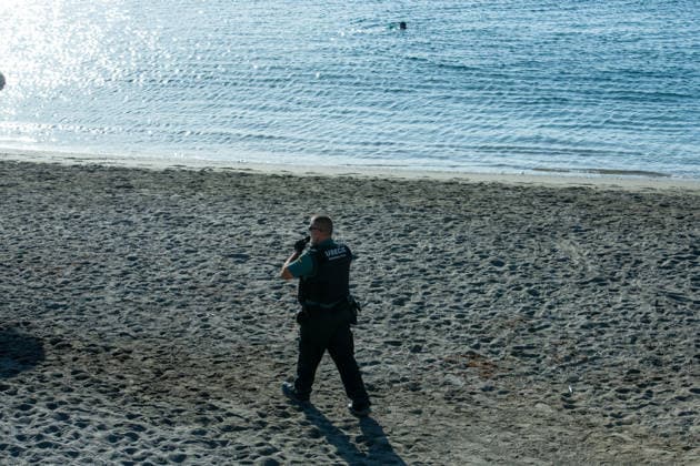 August 2, 2026, Ceuta, Madrid, Spain: A migrant attempts to swim across the border under the watchful eye of the Spanish Civil Guard at El Tarajal beach in Ceuta, Spain, August 2, 2026. Ceuta Spain  - ZUMAd308 20260802_zsp_d308_002 Copyright: xJuanxCarlosxLucasx