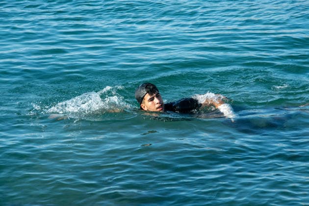 August 2, 2026, Ceuta, Madrid, Spain: A migrant attempts to swim across the border under the watchful eye of the Spanish Civil Guard at El Tarajal beach in Ceuta, Spain, August 2, 2026. Ceuta Spain  - ZUMAd308 20260802_zsp_d308_008 Copyright: xJuanxCarlosxLucasx