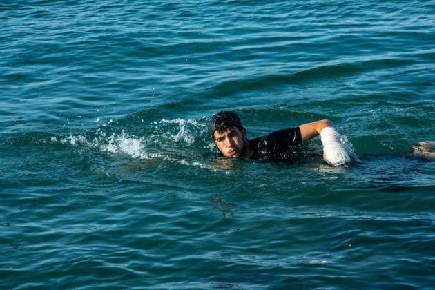 August 2, 2026, Ceuta, Madrid, Spain: A migrant attempts to swim across the border under the watchful eye of the Spanish Civil Guard at El Tarajal beach in Ceuta, Spain, August 2, 2026. Ceuta Spain  - ZUMAd308 20260802_zsp_d308_009 Copyright: xJuanxCarlosxLucasx