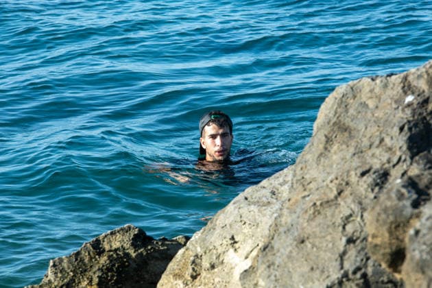 August 2, 2026, Ceuta, Madrid, Spain: A migrant attempts to swim across the border under the watchful eye of the Spanish Civil Guard at El Tarajal beach in Ceuta, Spain, August 2, 2026. Ceuta Spain  - ZUMAd308 20260802_zsp_d308_012 Copyright: xJuanxCarlosxLucasx