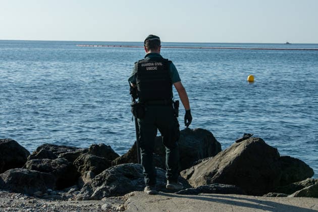 August 2, 2026, Ceuta, Madrid, Spain: A migrant attempts to swim across the border under the watchful eye of the Spanish Civil Guard at El Tarajal beach in Ceuta, Spain, August 2, 2026. Ceuta Spain - ZUMAd308 20260802_zsp_d308_014 Copyright: xJuanxCarlosxLucasx