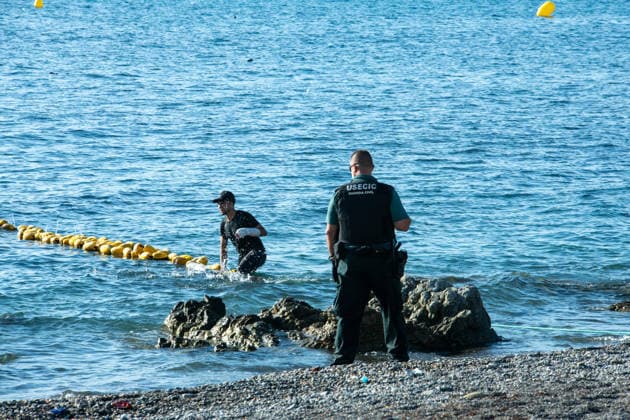 August 2, 2026, Ceuta, Madrid, Spain: A migrant attempts to swim across the border under the watchful eye of the Spanish Civil Guard at El Tarajal beach in Ceuta, Spain, August 2, 2026. Ceuta Spain  - ZUMAd308 20260802_zsp_d308_018 Copyright: xJuanxCarlosxLucasx