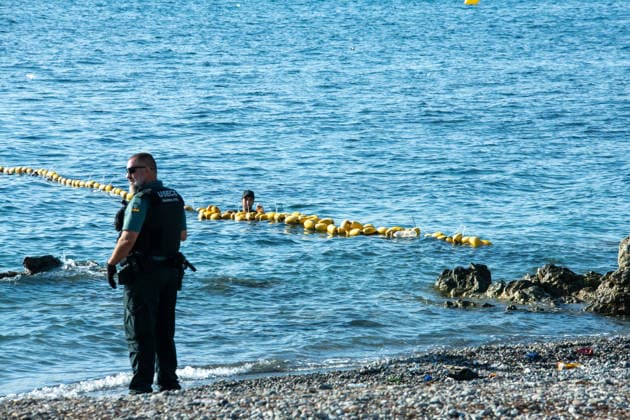 August 2, 2026, Ceuta, Madrid, Spain: A migrant attempts to swim across the border under the watchful eye of the Spanish Civil Guard at El Tarajal beach in Ceuta, Spain, August 2, 2026. Ceuta Spain - ZUMAd308 20260802_zsp_d308_019 Copyright: xJuanxCarlosxLucasx