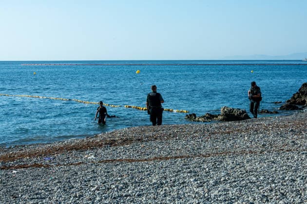 August 2, 2026, Ceuta, Madrid, Spain: A migrant attempts to swim across the border under the watchful eye of the Spanish Civil Guard at El Tarajal beach in Ceuta, Spain, August 2, 2026. Ceuta Spain - ZUMAd308 20260802_zsp_d308_022 Copyright: xJuanxCarlosxLucasx