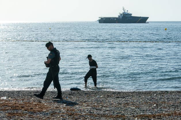 August 2, 2026, Ceuta, Madrid, Spain: A migrant attempts to swim across the border under the watchful eye of the Spanish Civil Guard at El Tarajal beach in Ceuta, Spain, August 2, 2026. Ceuta Spain - ZUMAd308 20260802_zsp_d308_024 Copyright: xJuanxCarlosxLucasx