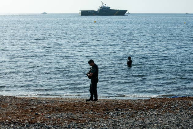 August 2, 2026, Ceuta, Madrid, Spain: A migrant attempts to swim across the border under the watchful eye of the Spanish Civil Guard at El Tarajal beach in Ceuta, Spain, August 2, 2026. Ceuta Spain  - ZUMAd308 20260802_zsp_d308_030 Copyright: xJuanxCarlosxLucasx