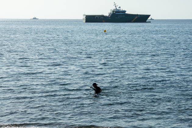 August 2, 2026, Ceuta, Madrid, Spain: A migrant attempts to swim across the border under the watchful eye of the Spanish Civil Guard at El Tarajal beach in Ceuta, Spain, August 2, 2026. Ceuta Spain  - ZUMAd308 20260802_zsp_d308_031 Copyright: xJuanxCarlosxLucasx