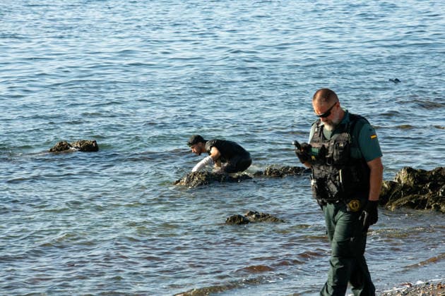 August 2, 2026, Ceuta, Madrid, Spain: A migrant attempts to swim across the border under the watchful eye of the Spanish Civil Guard at El Tarajal beach in Ceuta, Spain, August 2, 2026. Ceuta Spain  - ZUMAd308 20260802_zsp_d308_033 Copyright: xJuanxCarlosxLucasx