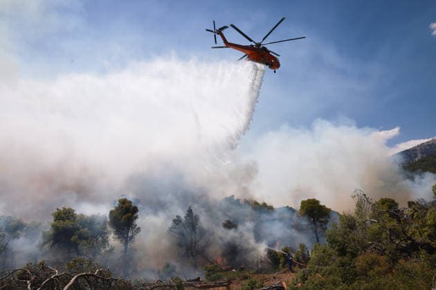 Firefighters battle wildfire in Viotia with air and ground operations VIOTIA, GREECE - AUGUST 2: A firefighting helicopter battles a wildfire burning near Porto Germeno, 70 kilometres northwest of Athens in the region of Viotia, Greece, on August 2, 2026 Costas Baltas Anadolu Viotia Greece. Editorial use only. Please get in touch for any other usage.  Copyright: x2026xAnadoluxCostasxBaltasx