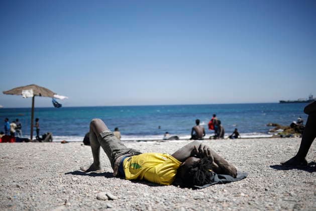 The barriers installed by the government in Ceuta are now fully operational. A person rests on the beach on August 2, 2026, in Ceuta, Spain. The Tarajal border has remained calm despite a small group of people attempting to swim across; but they were intercepted by the army. Although more than 48,000 migrants who had entered irregularly last Thursday have already left Ceuta, an unknown number of people who have refused to return remain in the city. AUGUST 2, 2026 PIXELATED MIGRATION CRISIS Jesú Ceuta Ceuta, Spain  Copyright: xJesusxTorresx 7699308