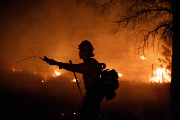 August 2, 2026, Prineville, Or, United States: AJacob Albertsen, a squad boss with Grayback Forestry, is silhouetted by flames burning through a forested area along U.S. Highway 26 at the Rowe Creek Complex fire, July 27, 2026 near Prineville, Oregon. The lightning-caused fires including the Brewer, Green Mountain and Crosswhite fires combined into one and have burnt 3000,597 acres and is 57% contained. Prineville United States - ZUMAp138 20260802_zaa_p138_004 Copyright: xAndrewxAvitt UsxForestx