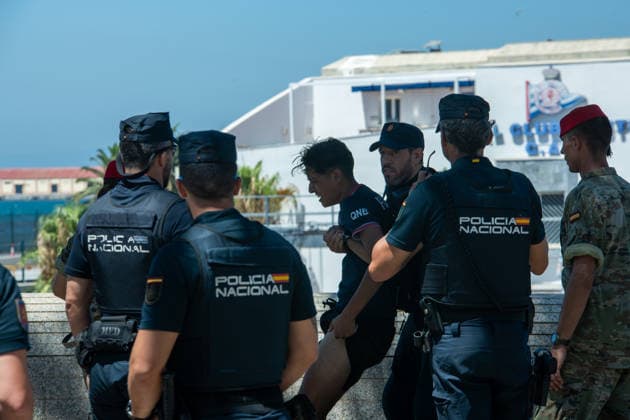 August 2, 2026, Ceuta, Madrid, Spain: Military personnel and police officers escort a group of Moroccan migrants toward the border with Morocco in the Spanish enclave of Ceuta, Spain, August 2, 2026. Armed forces and national police have begun rounding up and escorting the remaining migrants who entered irregularly during a massive migration crisis in recent days, allowing the city s streets and shops to return to normalcy. Ceuta Spain - ZUMAd308 20260802_zsp_d308_110 Copyright: xJuanxCarlosxLucasx