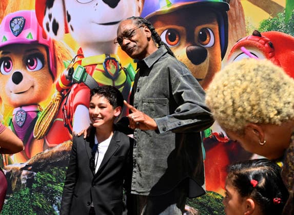 Cast members Rain Janjua and Snoop Dogg (R) attend the global premiere of the computer animated animal adventure Paw Patrol: The Dino Movie at the Paramount Picture Studio lot in Los Angeles on Sunday, August 2, 2026. Storyline: The Paw Patrol lands on a mysterious dinosaur island after a storm, where they meet Rex, a stranded pup. When Humdinger s reckless mining triggers a volcano, the team faces their biggest rescue mission yet to save the island.  LAP2026080225 JIMxRUYMEN