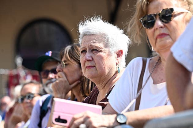 Bologna Massacre Remembrance Day Ceremony - Bologna Attendees hold photographs during the 46th anniversary commemoration of the Bologna Massacre on Remembrance Day in Bologna, Italy on August 2, 2024, remembering the 1974 bombing that resulted in 85 deaths and over 200 injuries. Photo by Gianni Schicchi IPA ABACAPRESS.COM Bologna  Copyright: xSchicchixGianni IPA ABACAx