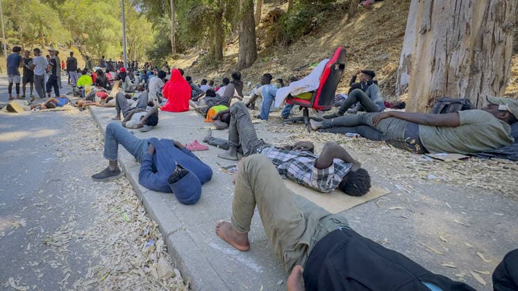 Migrant crisis in Cueta An unprecedented border crisis has hit the Spanish North African enclave of Ceuta, where an estimated 60,000 migrants crossed from Morocco. Pictured. African migrants resting on the street. 02.08.2026  Copyright: xIanxWhittakerx NINTCHDBPICT001099189195