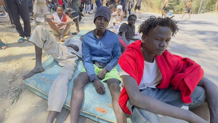 Migrant crisis in Cueta An unprecedented border crisis has hit the Spanish North African enclave of Ceuta, where an estimated 60,000 migrants crossed from Morocco. Pictured. African migrants resting on the street. 02.08.2026  Copyright: xIanxWhittakerx NINTCHDBPICT001099189213
