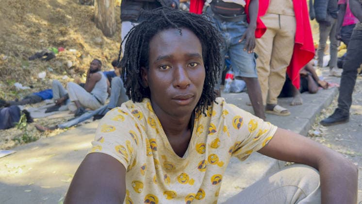 Migrant crisis in Cueta An unprecedented border crisis has hit the Spanish North African enclave of Ceuta, where an estimated 60,000 migrants crossed from Morocco..Pictured. Barefoot Mahummad Alkali, 18, a science student who says he fled ISIS-linked Boko Haram terrorists in his Nigerian homeland, outside Ceuta s asylum centre. 01.08.2026  Copyright: xIanxWhittakerx NINTCHDBPICT001099199075