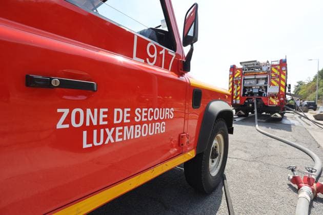 Firefighters pictured at the scene of a brush fire along the E25 highway in Bastogne, on Monday 03 August 2026. A major brush fire broke out Monday morning in the municipality of Bastogne, near the Withimont highway rest area.  JULIENxWARNAND 182681988