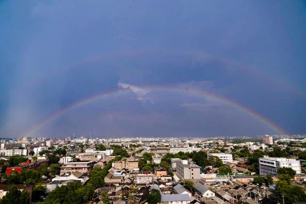 (260803) -- BEIJING, Aug. 3, 2026 -- Rainbows appear in the sky after rain in Beijing, capital of China, Aug. 3, 2026. ) CHINA-BEIJING-VIEW (CN) DuxJuanjuan 