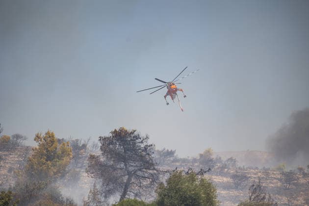 Wildfire in Greece s Megara region MEGARA, GREECE - AUGUST 3: Firefighters operate on the air as a wildfire continues to burn for a third consecutive day in the Megara region, west of Athens, Greece on August 3, 2026. Emergency services are working to contain the blaze amid challenging weather conditions across the area. Aris Oikonomou Anadolu Megara Greece. Editorial use only. Please get in touch for any other usage.  Copyright: x2026xAnadoluxArisxOikonomoux