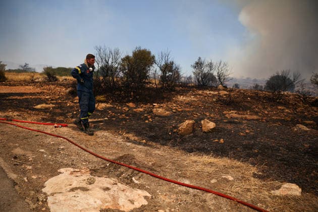 Wildfire in Greece s Megara region MEGARA, GREECE - AUGUST 3: Firefighters operate on the ground as a wildfire continues to burn for a third consecutive day in the Megara region, west of Athens, Greece on August 3, 2026. Emergency services are working to contain the blaze amid challenging weather conditions across the area. Aris Oikonomou Anadolu Megara Greece. Editorial use only. Please get in touch for any other usage.  Copyright: x2026xAnadoluxArisxOikonomoux