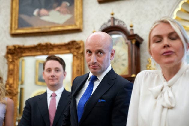 Trump White House Executive Order Signing WASHINGTON, DC - AUG. 3: White House Deputy Chief of Staff Stephen Miller and White House press secretary Karoline Leavitt, right, look on as U.S. President Donald Trump announces an executive order establishing the Presidential Military Spouse Commission on Monday, Aug. 3, 2026 in the Oval Office at the White House in Washington, D.C. (Photo by Allison Robbert Pool For The Washington Post) Washington DC United States  Copyright: xPool ABACAx