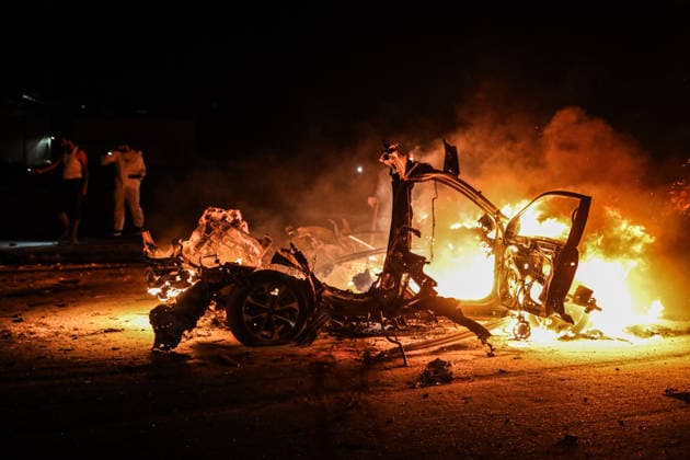 Two Palestinians killed in an Israeli attack on a vehicle in Gaza GAZA CITY, GAZA, PALESTINE - AUGUST 3: A view of a destroyed vehicle following an Israeli airstrike on Rashid Street in Gaza City, Gaza, Palestine on August 3, 2026. At least two Palestinians were killed and several others injured in the attack. Hamza Z. H. Qraiqea Anadolu Gaza City Gaza. Editorial use only. Please get in touch for any other usage.  Copyright: x2026xAnadoluxHamzaxZ.xH.xQraiqeax