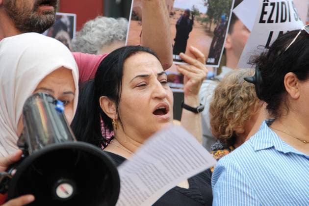 August 3, 2026, Izmir, ToÂ¼rkiye: ZMÄÂ°R, ToÂ¼rkiye Ã¢â‚¬ August 3, 2026: Members of the DEM Party WomenÃ¢â‚¬â ¢s Assembly and the Free WomenÃ¢â‚¬â ¢s Movement (Tevgera JinoÂªn Azad) hold a press statement in Alsancak to mark the 12th anniversary of the ISIS attack on the Yazidi community in Sinjar, Iraq. Participants display photographs of Yazidi women who were killed, abducted, or subjected to sexual slavery during the 2014 attacks, commemorating victims of atrocities recognized by the United Nations and the European Parliament as genocide. Izmir Türkiye  - ZUMAq101 20260803_zna_q101_028 Copyright: xNagihanxCakirx