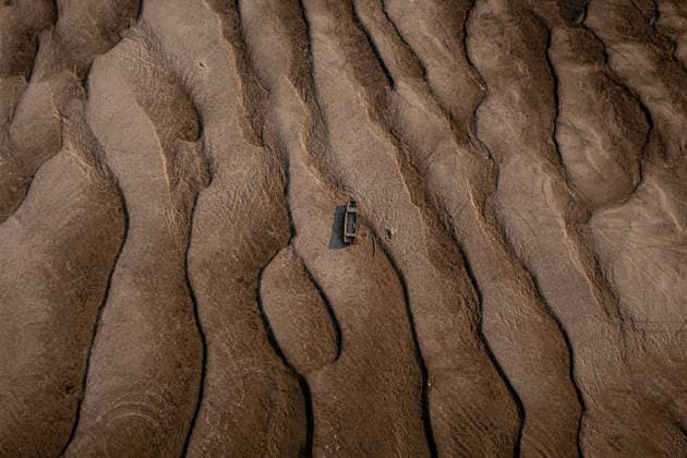 (260804) -- BEIJING, Aug. 4, 2026 -- An aerial drone photo taken on Aug. 2, 2026 shows the exposed riverbed of the Danube River in Dunaszentbenedek, Hungary. Hungary is entering its most critical 5 days as dropping water levels on the Danube River threaten the complete shutdown of the Paks nuclear power plant amid an extreme heatwave, Hungary s Prime Minister Peter Magyar said on Sunday, warning that the plant could be shut down for more than a month. (Photo by Xinhua) XINHUA PHOTOS OF THE DAY DavidxBalogh 